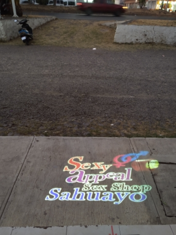 beautiful colorful gobo lighting up the streets at night in front of the door in night