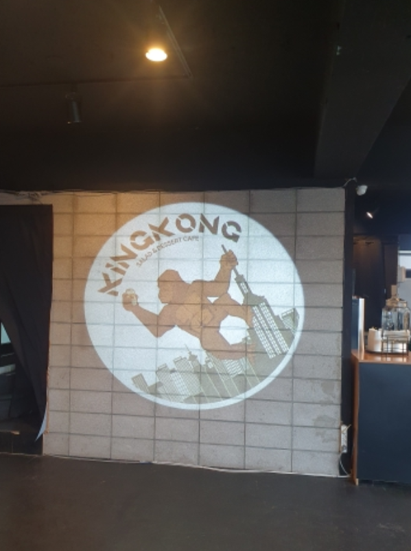 increasing visible Kong Kim with logo projector outdoor